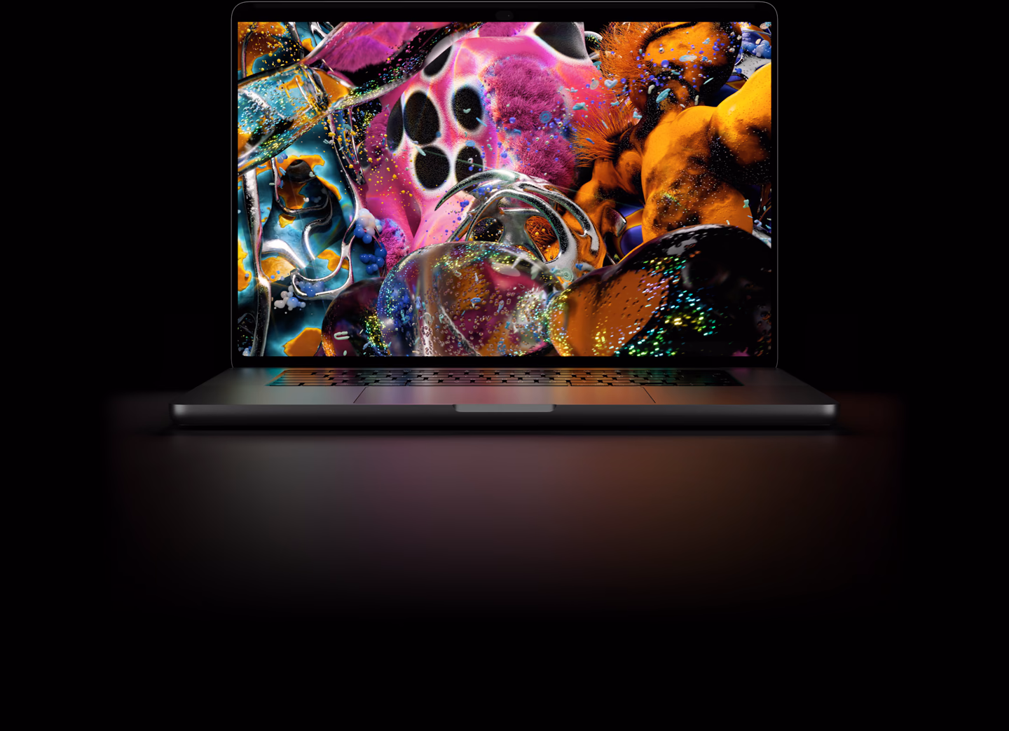 MacBook Pro with PROLED XDR Display, space black color, display shows a detailed image with high contrast and vivid colors, screen illuminates keyboard